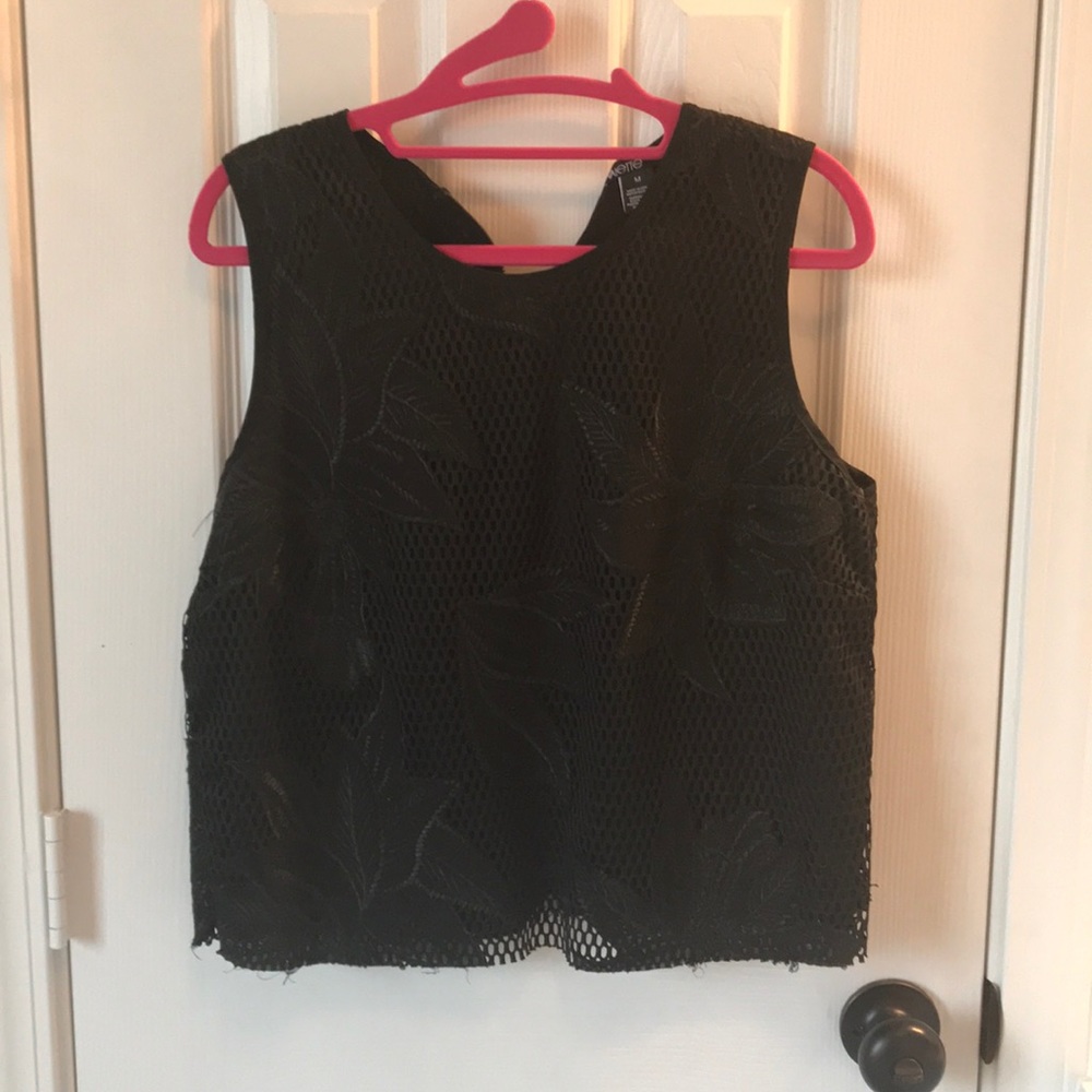 Crocheted black crop top. Hits above waist.